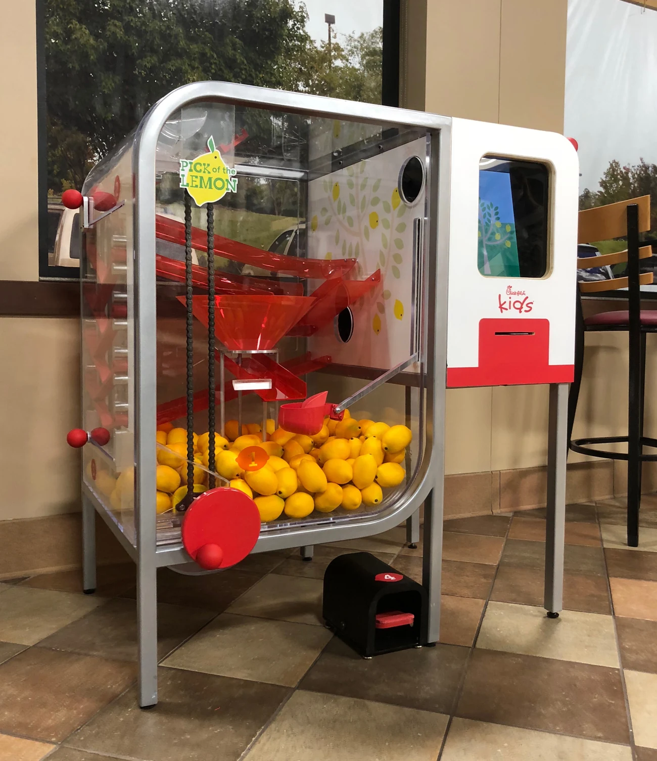 High-resolution front view of the Lemon Squeezy mechanism, crank, lemon path, screen, and pedal
